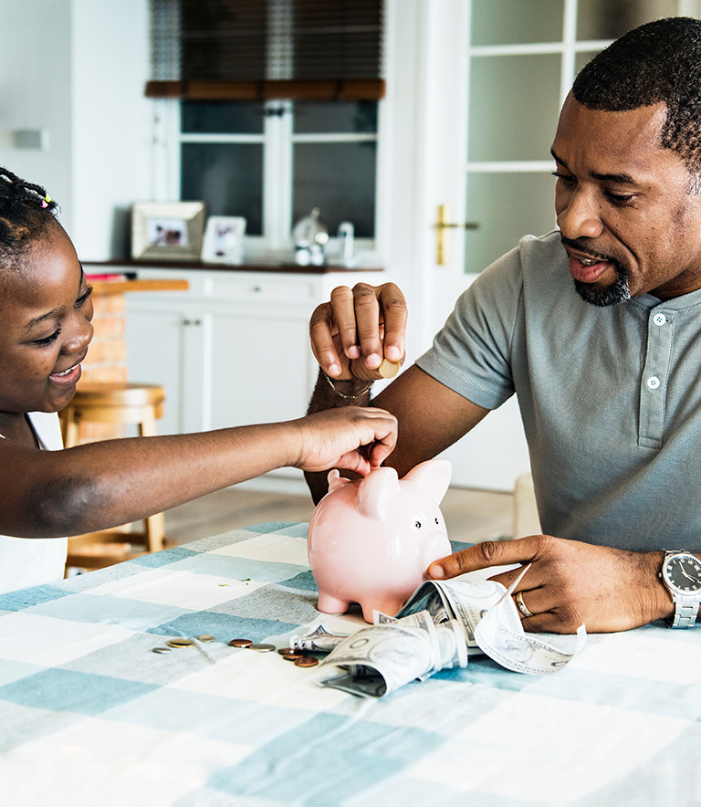 Dad And Daughter Saving Money